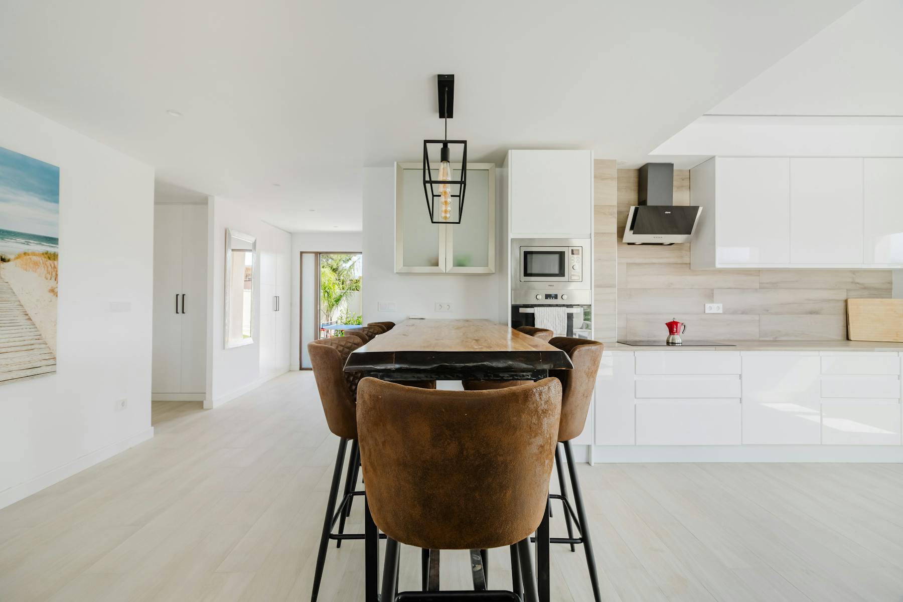 Bright fitted kitchen with island and dining space