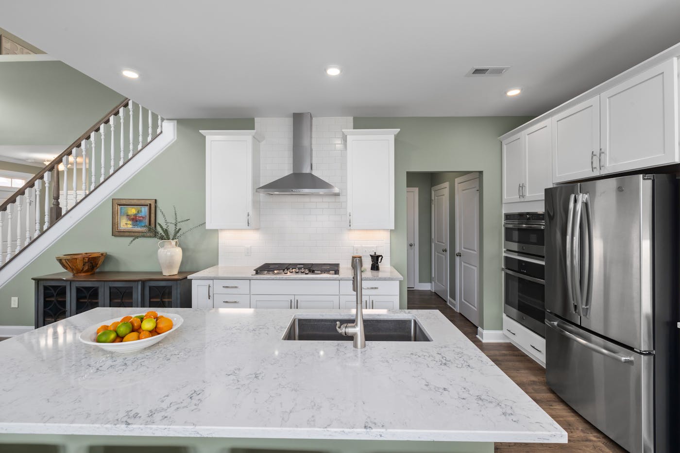 Green and white kitchen island installation